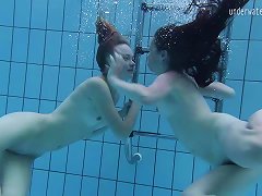 Two Lovely Babes Enjoy Making Out Passionately Under The Water
